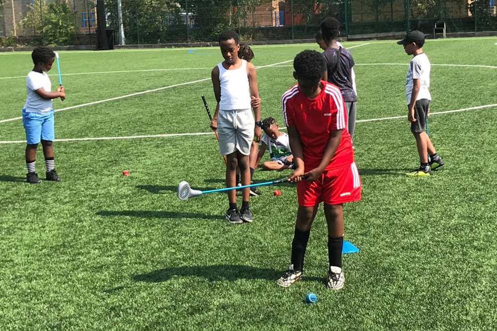 Kids playing golf at Jason Roberts Foundation