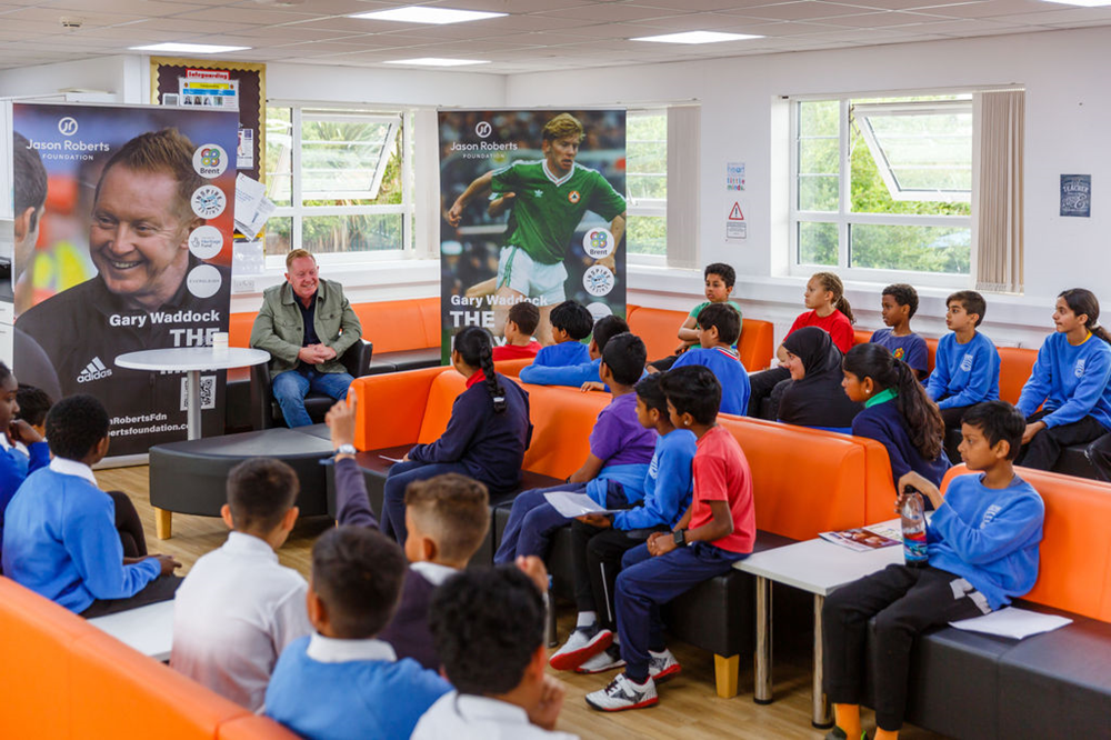 Gary Waddock talking to school pupils in class