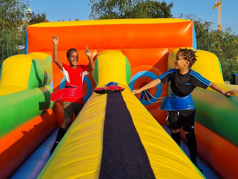 Children on inflatable slide