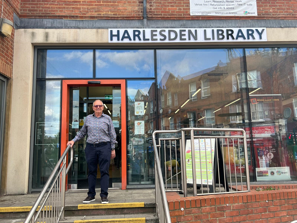 Chris Munro standing outside Harlesden Library