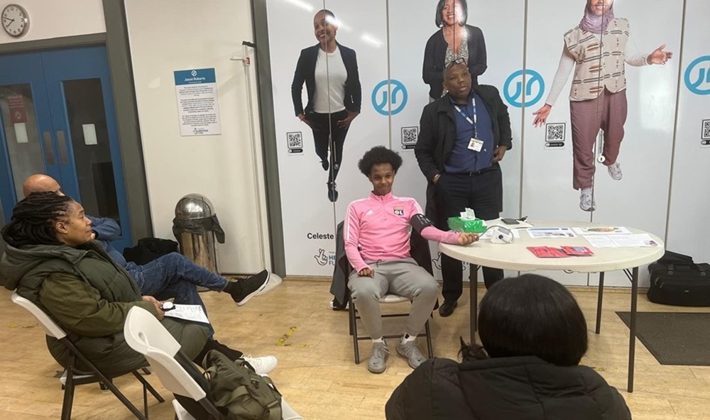 Staff being trained to do health checks