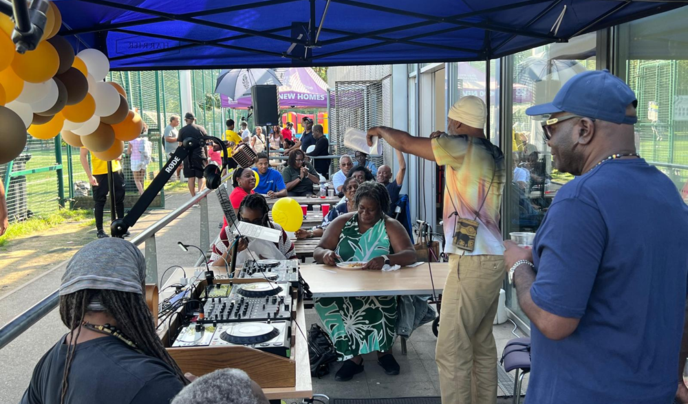 A crowd of Brent residents enjoying music and games